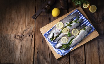 Fresh trout with lemon and various herbs