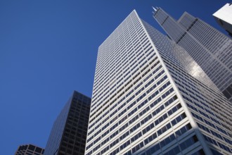 Looking up at business building in downtown, Chicago, USA. A view up through tall skyscrapers to a