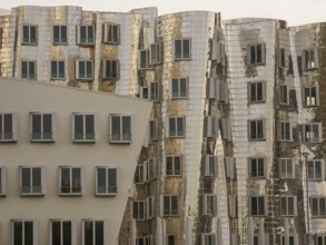Detailed view of modern, distorted buildings with reflective facades and many windows, düsseldorf,