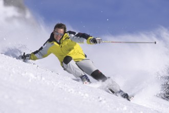 Skiers in action, deep snow, Austria