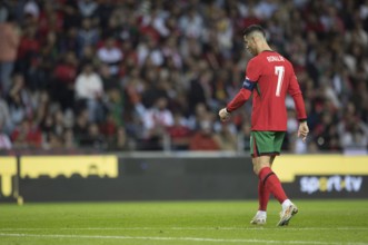 Football match, Captain Cristiano RONALDO CR7 Portugal walking to the left looking down and wearing