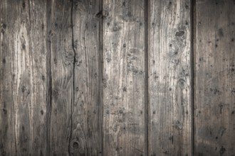 Rough wooden planks, dark and deteriorated by time
