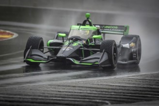 ROMAIN GROSJEAN (77) of Geneva, Switzerland comes through turn 12 (Canada Corner) during a wet