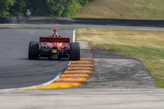 BENJAMIN PEDERSEN (R) (55) of Copenhagen, Denmark travels through the turns during a practice for