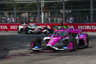 HELIO CASTRONEVES (06) of Sao Paulo, Brazil runs through the streets during the Honda Indy Toronto