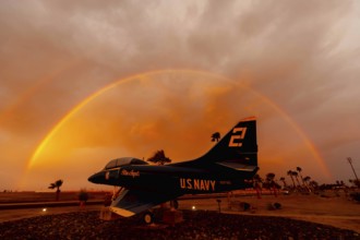 Dawn at Naval Air Field El Centro, CA: Sunlight paints vibrant hues across the sky, casting a