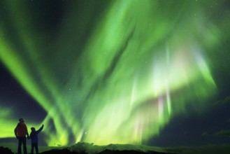 Father and Daughter looking at the Northern Lights
