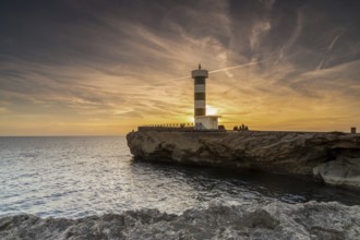 A view of the lighthouse at Colonia Sant Jordi in Mallorca at sunset