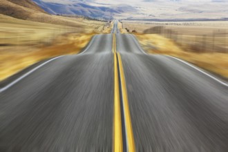 A Mirage on high speed. Magnificent American road and fencings on roadsides from snow drifts
