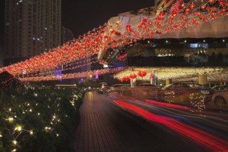Night street. Richly decorated hotel in the Chinese city before New year