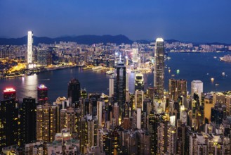 HONG KONG, CHINA - SEPTEMBER 29, 2024: Iconic view around sunset from Lugard Rd Lookout which