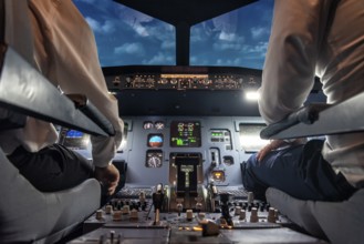 Pilots in the cockpit of an aircraft during a flight