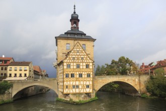 Obere bridge (brücke) and Altes Rathaus and cloudy sky in Bamberg, Germany