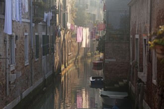 Drying clothes on the rope across venetian channel