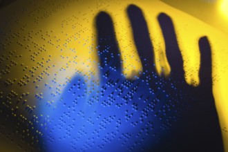 A book written in Braille for the blind. Braille for the blind, A book written in Braille. Braille