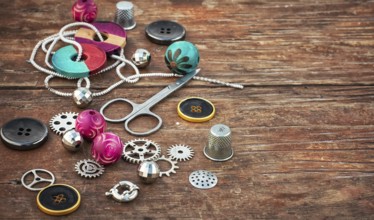 Beads and jewellery for handmade on light orange plate