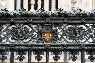 Forged metal fence near the Duomo Cathedral. Milan, Italy.