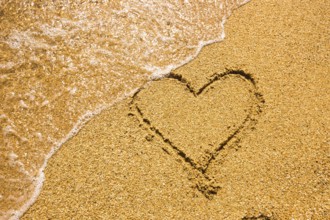 Heart symbol on the sand. Summer holiday concept. Romantic love background. Valentin Day theme. Top