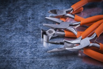 Metal insulated electric pliers nippers horizontal view electricity concept
