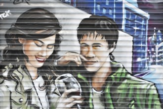 Madrid, Spain, Europe, Colourful mural of a laughing man and a woman drinking wine