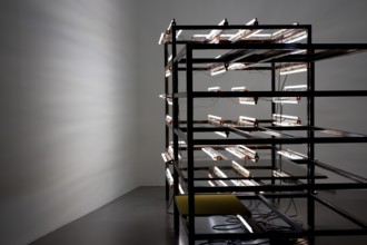 Neon light installation with cable connections on black at Tate Galley. London, United Kingdom