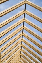 Modern cover made of laminated beams and glass plates