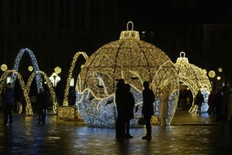 Christmas decorations with visitors on the cathedral square in Magdeburg