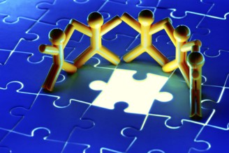 Team work on solving puzzle problem. Team work concept.