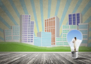 Businesswoman inside light bulb against city drawn concept