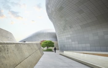 Business people walking among futuristic buildings in modern Seoul city