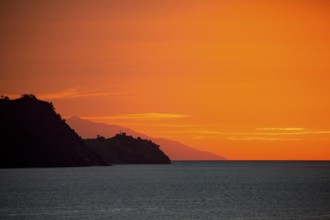 Silhouette of Flores Island at dusk and sunset