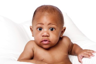 Cute beautiful adorable African baby face with huge eyes on white, Atlanta, USA