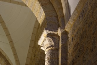 Detail of romanesque capital and column in church