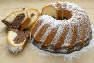 Traditional homemade marble cake. Sliced marble bundt cake on paper
