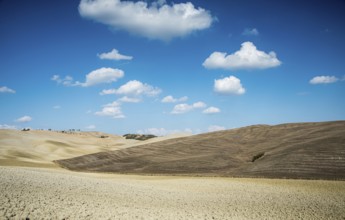 Beautiful idyllic farmland with meadow field at Tuscany area near Pienza touristic village, Italy
