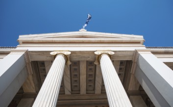 Exterior roof details and columns of Athens university building entrance