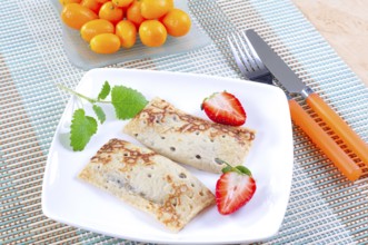 Sweet crepes with strawberries