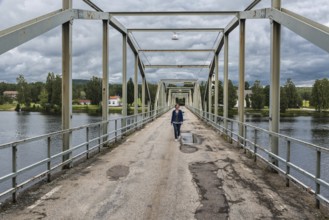 Sweden, 08 03 2019: Woman walking over the Milleniumbridge