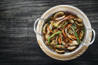 Gourmet portuguese clam and vegetable seafood stew in spicy tomato sauce