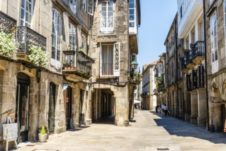 Santiago de Compostela, Spain, July 18, 2020: Old street with arcades in medieval town