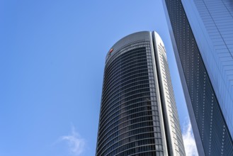 Madrid, Spain, May 10, 2020: Low angle view of office building in the city of Madrid against blue