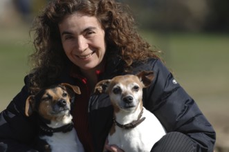 Woman with two Jack Russell terriers