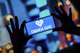 In this photo illustration, the Osaka Gas logo is seen displayed on a smartphone