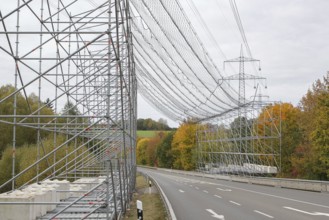 A scaffold with steel net as protection over a road, safety measure due to work on an overhead line