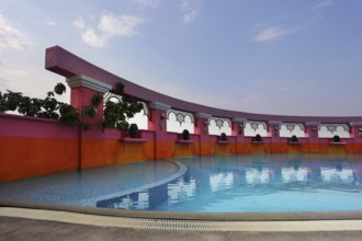 Beautiful pool in magnificent hotel of Bangkok. A sunset