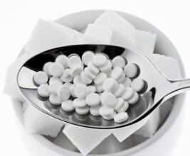 Low calorie sweetener and sugar cubes. Symbol for calories and diet, Austria