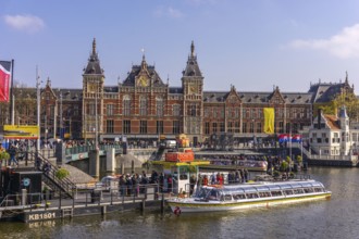 The city of Amsterdam in springtime with houses and water is a famous travel location