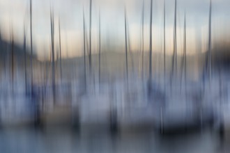 Blurred depiction of boat masts in the harbour, Locarno, Lake Maggiore, Canton Ticino, Switzerland