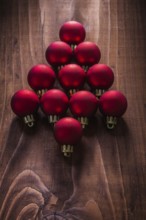 Composition red christmas balls in the form simbold of fir tree