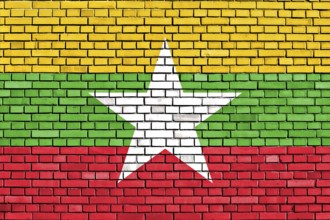 Flag of Myanmar painted on brick wall